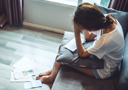 Woman worried about paying bills