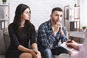 A couple working together with a therapist