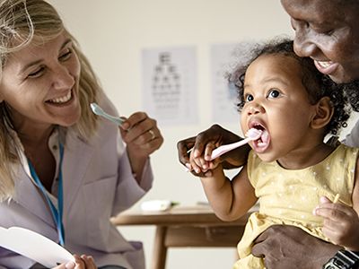 Teaching a child to brush her teeth