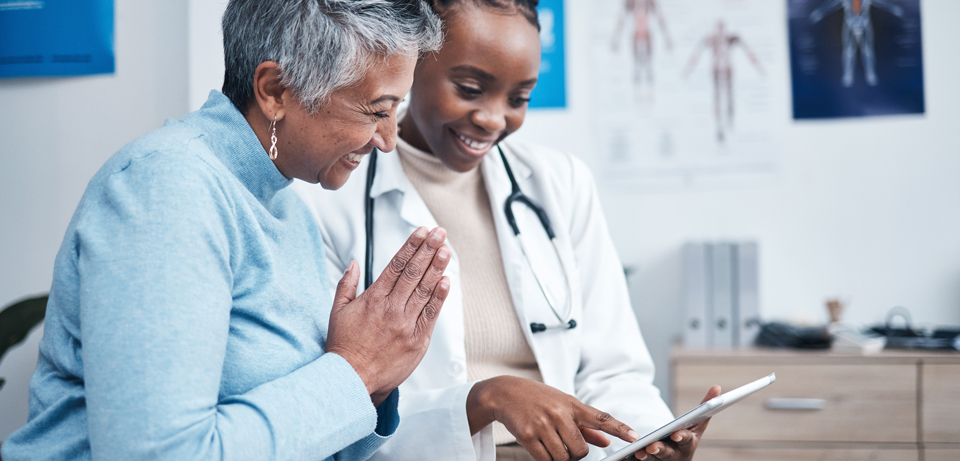 Doctor and patient reviewing chart