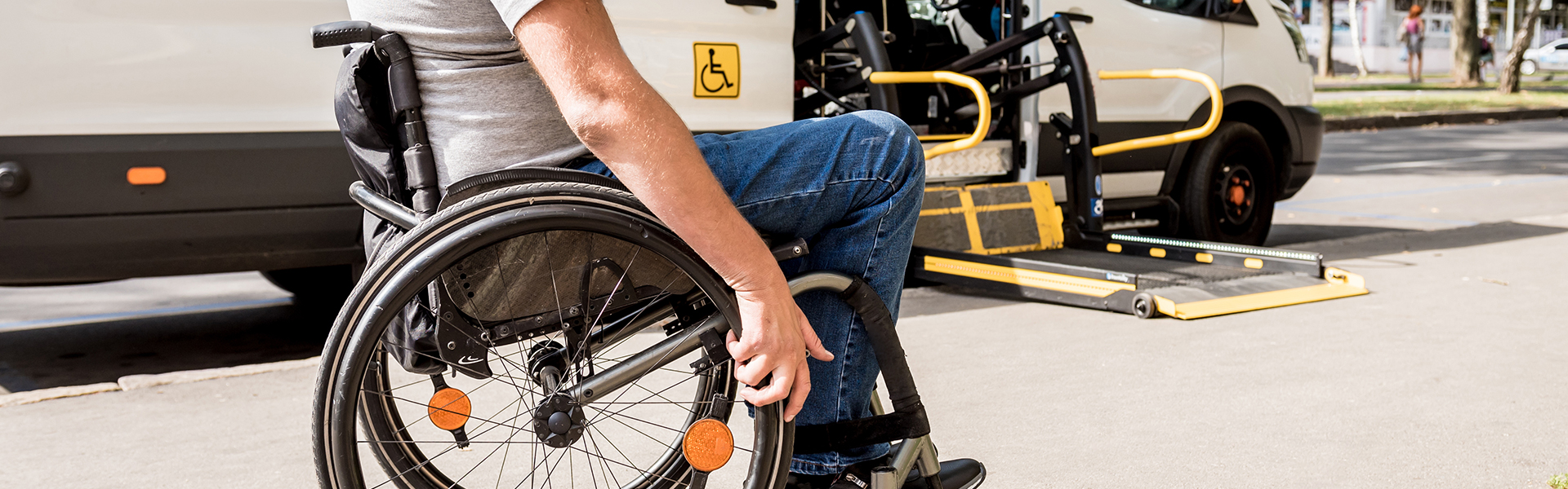 Sign Up for Functional Needs List - Man in Wheelchair approaching transport van